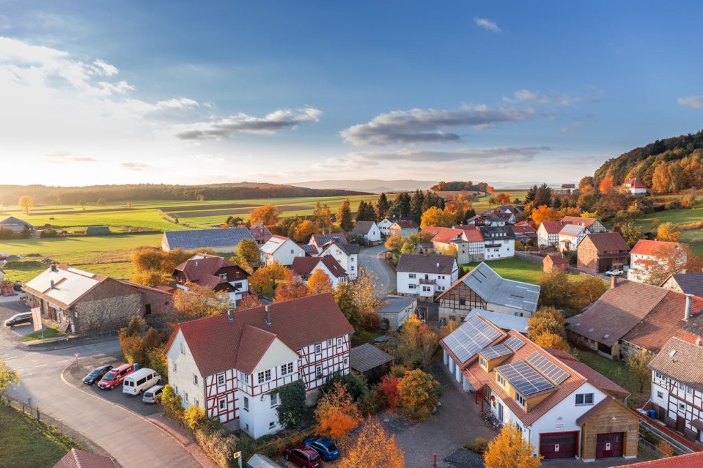 pexels photo 280221 Charming aerial view of a rural village in autumn with vivid colors and clear skies.