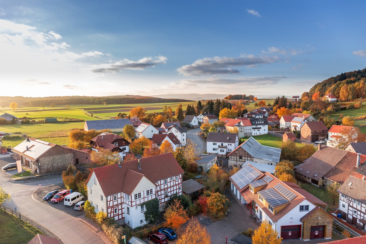 Sectors Charming aerial view of a rural village in autumn with vivid colors and clear skies.